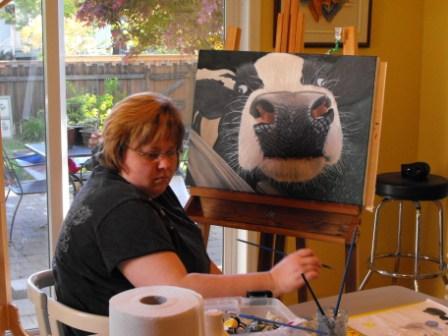 Sharka painting a cow